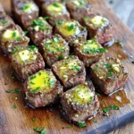 - 1.5 lbs sirloin steak - 4 tablespoons unsalted butter - 4 cloves minced garlic - 1 teaspoon fresh thyme or ½ teaspoon dried thyme - Salt and pepper - 2 tablespoons olive oil - Fresh parsley for garnish You can swap sirloin steak for flank or ribeye. Both cuts work well. If you prefer a dairy-free option, try using vegan butter or olive oil. Fresh herbs add bright flavor. However, dried herbs also taste great and are easy to use. - Large skillet - Chef's knife - Cutting board - Tongs or spatula - Measuring spoons Using these tools makes cooking simpler. A large skillet helps achieve that perfect sear. A chef's knife allows for easy cutting of steak. The right measurements ensure the best taste. To start, cut your sirloin steak into 1-inch cubes. This size gives a nice bite. Next, season the steak cubes with salt and pepper. Make sure each cube gets a good coat. This step adds flavor to every bite. Let the seasoned steak sit at room temperature for about 10 minutes. This helps it cook evenly. Now, heat 2 tablespoons of olive oil in a large skillet over medium-high heat. Once the oil is hot, add the steak bites in a single layer. Do not overcrowd the pan; this keeps the heat high. Sear the steak bites for 2 to 3 minutes on each side. Look for a nice brown crust to form. This browning adds great flavor. If you have too many steak bites, cook them in batches. After searing, remove the steak bites from the skillet and set them aside. Lower the heat to medium and add 4 tablespoons of unsalted butter to the same skillet. Allow the butter to melt slowly. Once melted, add 4 minced garlic cloves and 1 teaspoon of fresh thyme or ½ teaspoon of dried thyme. Stir these in and sauté for about 1 minute. You want to smell that rich garlic aroma! Return the steak bites to the skillet. Toss them in the garlic butter until they are well coated. Cook for an additional 1 to 2 minutes for a medium-rare finish. Adjust the time if you prefer a different doneness. Finally, remove the skillet from heat and garnish with chopped parsley. Enjoy your delicious garlic butter steak bites! To get your steak bites just right, I recommend using a meat thermometer. A quick check ensures your steak is cooked to your liking. For medium-rare, aim for 130°F. For medium, go for 140°F. Adjust the cooking time based on your preference. If you like it well done, cook a bit longer. To boost flavor, think about adding extra seasonings. A sprinkle of smoked paprika can add a nice kick. You can also try cumin or even a touch of chili powder. Marinating the steak cubes before cooking can really deepen the taste. A simple mix of olive oil, soy sauce, and garlic works well. Let it sit for at least 30 minutes if you can. When serving, think about fun and creative ways to present your steak bites. You can use a wooden board or a cast-iron skillet. It gives a rustic feel. Add toothpicks for easy snacking. To make it look extra special, drizzle more melted garlic butter on top. Fresh parsley adds a nice splash of color too! {{image_2}} You can use different cuts of steak for your bites. Sirloin is great, but you can also try ribeye or tenderloin. These cuts will give you a rich flavor and tender texture. Each cut brings its own taste, so don’t hesitate to explore. Marinades can add more flavor to your steak bites. A simple marinade of soy sauce, garlic, and honey works wonders. You can also try balsamic vinegar for a tangy twist. Let the steak sit in the marinade for at least 30 minutes. This will enhance the taste and make each bite more exciting. If you want some heat, add crushed red pepper to the garlic butter. This spice gives a nice kick without overpowering the dish. Just a pinch will do, but adjust based on your taste. Different herbs can also change the flavor. Try adding fresh rosemary or oregano for a new twist. These herbs pair well with garlic and butter, making each bite more flavorful. Fresh herbs make the dish lively and fragrant. Garlic butter steak bites go well with sides like garlic mashed potatoes. The creamy texture complements the steak perfectly. Roasted vegetables are also a great choice. Their charred flavor adds depth to the meal. For dipping, consider a creamy garlic aioli or a spicy sriracha sauce. These sauces add a fun element to your meal. You can also serve the steak bites on a wooden board for a rustic look. To store leftover steak bites, let them cool first. Place them in an airtight container. This helps keep them fresh. Use a container that seals well to avoid air. I recommend glass or plastic containers. They stack well in the fridge. Store the steak bites in the fridge for up to three days. You can freeze cooked steak bites for longer storage. Allow them to cool completely before freezing. Place them in a freezer-safe bag or container. Squeeze out as much air as possible. This prevents freezer burn. To thaw, move the container to the fridge for a few hours or overnight. For quick thawing, place the bag in cold water. When ready to eat, reheat them in a skillet over low heat until warm. For food safety, always check the date before eating. Properly stored steak bites last three days in the fridge. If frozen, they can last up to three months. Signs of spoilage include a sour smell or an off color. If something seems wrong, throw it away. Your health is more important than wasting food. Yes, you can use pre-cooked steak. This option saves time. Just heat it in the skillet with garlic butter. Cut the steak into bite-sized pieces. Sear them in the pan for a minute or two. This warms the steak and adds flavor. You can also use leftover steak for this recipe. Just remember to adjust cooking times since the steak is already cooked. You can serve Garlic Butter Steak Bites with many sides. Here are some popular options: - Garlic mashed potatoes - Roasted vegetables - Rice or quinoa - Salad with fresh greens - Crusty bread to soak up the butter These sides balance the rich flavors of the steak bites. They also add color and texture to your meal. To make this recipe low-carb, you can skip the bread. Instead, focus on low-carb sides. Here are some tips: - Serve with steamed broccoli or cauliflower rice. - Use zucchini noodles instead of pasta. - Add a side salad with leafy greens and a light dressing. These changes keep the meal tasty while lowering carbs. Enjoy your Garlic Butter Steak Bites without the guilt! In this post, we explored the tasty world of Garlic Butter Steak Bites. We covered essential ingredients, tools, and step-by-step instructions for perfect steak bites. I shared tips for doneness, flavor, and presentation, as well as variations to suit your taste. Proper storage info ensures your leftovers stay fresh. Remember, cooking is about joy and creativity. Use this guide to make a meal that will impress your family and friends. Enjoy every bite!