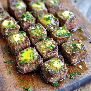 - 1.5 lbs sirloin steak - 4 tablespoons unsalted butter - 4 cloves minced garlic - 1 teaspoon fresh thyme or ½ teaspoon dried thyme - Salt and pepper - 2 tablespoons olive oil - Fresh parsley for garnish You can swap sirloin steak for flank or ribeye. Both cuts work well. If you prefer a dairy-free option, try using vegan butter or olive oil. Fresh herbs add bright flavor. However, dried herbs also taste great and are easy to use. - Large skillet - Chef's knife - Cutting board - Tongs or spatula - Measuring spoons Using these tools makes cooking simpler. A large skillet helps achieve that perfect sear. A chef's knife allows for easy cutting of steak. The right measurements ensure the best taste. To start, cut your sirloin steak into 1-inch cubes. This size gives a nice bite. Next, season the steak cubes with salt and pepper. Make sure each cube gets a good coat. This step adds flavor to every bite. Let the seasoned steak sit at room temperature for about 10 minutes. This helps it cook evenly. Now, heat 2 tablespoons of olive oil in a large skillet over medium-high heat. Once the oil is hot, add the steak bites in a single layer. Do not overcrowd the pan; this keeps the heat high. Sear the steak bites for 2 to 3 minutes on each side. Look for a nice brown crust to form. This browning adds great flavor. If you have too many steak bites, cook them in batches. After searing, remove the steak bites from the skillet and set them aside. Lower the heat to medium and add 4 tablespoons of unsalted butter to the same skillet. Allow the butter to melt slowly. Once melted, add 4 minced garlic cloves and 1 teaspoon of fresh thyme or ½ teaspoon of dried thyme. Stir these in and sauté for about 1 minute. You want to smell that rich garlic aroma! Return the steak bites to the skillet. Toss them in the garlic butter until they are well coated. Cook for an additional 1 to 2 minutes for a medium-rare finish. Adjust the time if you prefer a different doneness. Finally, remove the skillet from heat and garnish with chopped parsley. Enjoy your delicious garlic butter steak bites! To get your steak bites just right, I recommend using a meat thermometer. A quick check ensures your steak is cooked to your liking. For medium-rare, aim for 130°F. For medium, go for 140°F. Adjust the cooking time based on your preference. If you like it well done, cook a bit longer. To boost flavor, think about adding extra seasonings. A sprinkle of smoked paprika can add a nice kick. You can also try cumin or even a touch of chili powder. Marinating the steak cubes before cooking can really deepen the taste. A simple mix of olive oil, soy sauce, and garlic works well. Let it sit for at least 30 minutes if you can. When serving, think about fun and creative ways to present your steak bites. You can use a wooden board or a cast-iron skillet. It gives a rustic feel. Add toothpicks for easy snacking. To make it look extra special, drizzle more melted garlic butter on top. Fresh parsley adds a nice splash of color too! {{image_2}} You can use different cuts of steak for your bites. Sirloin is great, but you can also try ribeye or tenderloin. These cuts will give you a rich flavor and tender texture. Each cut brings its own taste, so don’t hesitate to explore. Marinades can add more flavor to your steak bites. A simple marinade of soy sauce, garlic, and honey works wonders. You can also try balsamic vinegar for a tangy twist. Let the steak sit in the marinade for at least 30 minutes. This will enhance the taste and make each bite more exciting. If you want some heat, add crushed red pepper to the garlic butter. This spice gives a nice kick without overpowering the dish. Just a pinch will do, but adjust based on your taste. Different herbs can also change the flavor. Try adding fresh rosemary or oregano for a new twist. These herbs pair well with garlic and butter, making each bite more flavorful. Fresh herbs make the dish lively and fragrant. Garlic butter steak bites go well with sides like garlic mashed potatoes. The creamy texture complements the steak perfectly. Roasted vegetables are also a great choice. Their charred flavor adds depth to the meal. For dipping, consider a creamy garlic aioli or a spicy sriracha sauce. These sauces add a fun element to your meal. You can also serve the steak bites on a wooden board for a rustic look. To store leftover steak bites, let them cool first. Place them in an airtight container. This helps keep them fresh. Use a container that seals well to avoid air. I recommend glass or plastic containers. They stack well in the fridge. Store the steak bites in the fridge for up to three days. You can freeze cooked steak bites for longer storage. Allow them to cool completely before freezing. Place them in a freezer-safe bag or container. Squeeze out as much air as possible. This prevents freezer burn. To thaw, move the container to the fridge for a few hours or overnight. For quick thawing, place the bag in cold water. When ready to eat, reheat them in a skillet over low heat until warm. For food safety, always check the date before eating. Properly stored steak bites last three days in the fridge. If frozen, they can last up to three months. Signs of spoilage include a sour smell or an off color. If something seems wrong, throw it away. Your health is more important than wasting food. Yes, you can use pre-cooked steak. This option saves time. Just heat it in the skillet with garlic butter. Cut the steak into bite-sized pieces. Sear them in the pan for a minute or two. This warms the steak and adds flavor. You can also use leftover steak for this recipe. Just remember to adjust cooking times since the steak is already cooked. You can serve Garlic Butter Steak Bites with many sides. Here are some popular options: - Garlic mashed potatoes - Roasted vegetables - Rice or quinoa - Salad with fresh greens - Crusty bread to soak up the butter These sides balance the rich flavors of the steak bites. They also add color and texture to your meal. To make this recipe low-carb, you can skip the bread. Instead, focus on low-carb sides. Here are some tips: - Serve with steamed broccoli or cauliflower rice. - Use zucchini noodles instead of pasta. - Add a side salad with leafy greens and a light dressing. These changes keep the meal tasty while lowering carbs. Enjoy your Garlic Butter Steak Bites without the guilt! In this post, we explored the tasty world of Garlic Butter Steak Bites. We covered essential ingredients, tools, and step-by-step instructions for perfect steak bites. I shared tips for doneness, flavor, and presentation, as well as variations to suit your taste. Proper storage info ensures your leftovers stay fresh. Remember, cooking is about joy and creativity. Use this guide to make a meal that will impress your family and friends. Enjoy every bite!
