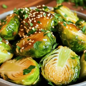 - 1 pound Brussels sprouts, trimmed and halved - 2 tablespoons olive oil - 4 tablespoons honey - 3 cloves garlic, minced - 1 tablespoon soy sauce - Salt and pepper to taste - 1 tablespoon sesame seeds (optional for garnish) - Chopped fresh parsley for garnish (optional) - You can swap Brussels sprouts for green beans or cauliflower if preferred. - Use maple syrup instead of honey for a vegan option. - For a gluten-free dish, pick a gluten-free soy sauce. - Sesame seeds add a nice crunch and flavor. - Chopped parsley gives a fresh look and taste. - Try adding a squeeze of lemon for a zesty twist. Preheat your air fryer to 375°F (190°C). This step is key for getting crispy sprouts. A hot air fryer helps cook the sprouts evenly and adds that golden color. Trim and halve 1 pound of Brussels sprouts. Look for fresh sprouts, as they taste best. Rinse them under cold water to remove dirt. In a large bowl, add the halved sprouts and 2 tablespoons of olive oil. Toss them well so every piece gets coated. This olive oil helps the honey garlic sauce stick and gives a nice crunch. In a small bowl, mix together 4 tablespoons of honey, 3 cloves of minced garlic, and 1 tablespoon of soy sauce. Add salt and pepper to taste. Whisk until smooth. This sauce is sweet and savory, making the sprouts extra tasty. Pour the honey garlic mix over the sprouts and toss again. Make sure every piece is covered well. Place the coated Brussels sprouts in the air fryer basket. Keep them in a single layer. This allows hot air to flow freely around each sprout. Air fry for 12-15 minutes. Shake the basket halfway through. This step helps them cook evenly. Look for that golden brown color and crispiness. To get the best crunch, do not overcrowd the basket. If you have more sprouts, air fry them in batches. Also, shaking the basket helps them crisp up. You can check them a minute or two before the time is up. If they need more time, let them cook a bit longer. Enjoy the crispy delight! To get the best results when cooking Brussels sprouts, choose fresh ones. Look for bright green sprouts with tight leaves. Trim the ends and cut them in half for even cooking. Make sure to coat them well in olive oil. This helps them crisp up nicely. Avoid overcrowding the air fryer basket. Give each sprout room to breathe. This promotes even cooking and browning. You can easily adjust the seasoning to fit your taste. If you like it sweeter, add more honey. If you want it saltier, increase the soy sauce. A pinch of red pepper flakes can add heat. Taste your honey garlic mixture before tossing it with the sprouts. This will help you find the right balance. Feel free to get creative with spices, too. Serve your air fryer honey garlic Brussels sprouts as a side dish. They pair well with grilled chicken or fish. You can also toss them into a salad for added crunch. For a fun twist, serve them on skewers for a party. Add some sesame seeds and fresh parsley on top for color and flavor. Enjoy your crispy delight! {{image_2}} Want a kick? Just add chili flakes. Start by mixing in one teaspoon of crushed chili flakes with your honey garlic sauce. This small change makes a big impact. It adds heat and balances the sweetness of the honey. You will love the extra flavor. If you crave something tangy, try balsamic glaze. Swap the honey in the recipe with balsamic glaze. This switch gives a rich flavor that pairs well with Brussels sprouts. Drizzle it on right before serving for a tasty twist. You can also mix it with the soy sauce for added depth. Feel free to mix in other veggies for fun. Carrots, bell peppers, or sweet potatoes work well. Just cut them into similar sizes as the Brussels sprouts. This helps everything cook evenly. Toss them in with the olive oil and sauce for a colorful, healthy dish. You can create your own veggie blend for unique flavors. Store leftover honey garlic Brussels sprouts in an airtight container. This keeps them fresh and tasty. Let them cool first to avoid steam. You can keep them in the fridge for up to three days. For best taste, eat them soon after cooking. Reheat the Brussels sprouts in the air fryer for a few minutes. Set the air fryer to 375°F (190°C) and cook for five to seven minutes. This helps restore their crispiness. You can also use a microwave, but they may lose some crunch. You can freeze Brussels sprouts for later use. Place them in a single layer on a baking sheet. Freeze until firm, then transfer to a freezer bag. They can last up to three months in the freezer. To use, thaw them in the fridge overnight before reheating. Yes, you can make these Brussels sprouts ahead of time. Cook them and let them cool. Store them in an airtight container in the fridge. They will stay fresh for up to three days. When you’re ready to eat, just reheat them in the air fryer for about 5 minutes. This will help restore their crispiness. If you need a honey substitute, consider maple syrup or agave nectar. Both will give you sweetness, though the flavor will change a bit. You can also use brown sugar mixed with a bit of water. This will mimic the stickiness of honey. To keep Brussels sprouts crispy, ensure they are dry before cooking. After washing, pat them with a paper towel. Use enough oil, but not too much, to help with crisping. Don't overcrowd the air fryer basket; this allows hot air to circulate around them. Yes, you can cook frozen Brussels sprouts in the air fryer. Start by adding them directly to the basket. Increase the cooking time to about 15-18 minutes. Shake the basket halfway through to ensure even cooking. They may not get as crispy as fresh ones, but they will still taste great. In this blog post, we covered how to make delicious Air Fryer Honey Garlic Brussels sprouts. We listed ingredients and their notes, provided step-by-step instructions, and shared tips for the best results. I also discussed fun variations and storage tips. With these simple methods, you can enjoy crispy, tasty Brussels sprouts at home. Experiment with flavors and find what you like best. You’ll impress your family and friends with this healthy dish!