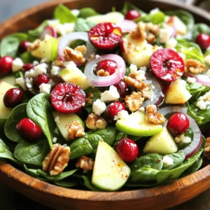 To make a delicious Apple Cranberry Walnut Salad, gather these fresh ingredients: - 2 cups fresh spinach, washed and dried - 1 apple (Granny Smith or Honeycrisp), cored and diced - 1 cup fresh cranberries, halved (or dried cranberries if fresh aren't available) - 1/2 cup walnuts, roughly chopped - 1/2 cup feta cheese, crumbled - 1/4 red onion, thinly sliced - 1/4 cup olive oil - 2 tablespoons apple cider vinegar - 1 tablespoon honey - Salt and pepper to taste This recipe serves four people. You can adjust the portion sizes to suit your needs. If you want a bigger salad, just double the ingredients. For a smaller salad, cut the amounts in half. If you prefer a nut-free version, skip the walnuts or swap them for seeds, like sunflower seeds. You may use any apple you like, but I recommend Granny Smith for a tart taste. If cranberries are out of season, dried cranberries work well too. Each ingredient in this salad brings health benefits: - Spinach is rich in iron, which is good for your blood. - Apples provide fiber, which helps with digestion. - Cranberries are packed with antioxidants, helping to fight illness. - Walnuts contain healthy fats that are good for your heart. - Feta cheese adds calcium, which is great for strong bones. - Red onion contains quercetin, which may boost your immune system. - Olive oil is a source of healthy fats, promoting heart health. - Apple cider vinegar may help with blood sugar control. - Honey adds natural sweetness and has antibacterial properties. - Salt and pepper enhance flavors but should be used in moderation. This salad not only tastes amazing but also nourishes your body with each bite! To start, gather your dressing ingredients. You need olive oil, apple cider vinegar, honey, salt, and pepper. In a small bowl, combine 1/4 cup olive oil, 2 tablespoons apple cider vinegar, and 1 tablespoon honey. Add a pinch of salt and a dash of pepper. Whisk everything together until smooth. This dressing adds a nice tang and sweetness to the salad. Now, let’s build the salad. Take a large salad bowl and add 2 cups of fresh spinach. This spinach forms the base. Next, dice 1 apple, either Granny Smith or Honeycrisp. Sprinkle the diced apple over the spinach. Then, take 1 cup of fresh cranberries, halved, and add them to the bowl. If you’re using dried cranberries, that works too. Next, add 1/2 cup of roughly chopped walnuts. These nuts give a great crunch. Now, slice 1/4 of a red onion very thin. Add the onion slices to the mix. Once all ingredients are in the bowl, it’s time to dress the salad. Drizzle the dressing over the top. Using tongs, toss the salad gently. Make sure all the ingredients are coated well. Finally, sprinkle 1/2 cup of crumbled feta cheese on top for extra flavor. You can serve the salad right away or chill it for 15 minutes. Chilling lets the flavors blend nicely. Serve it in large bowls or on individual plates. Garnish with a few extra cranberries and a walnut for a nice touch. Enjoy your fresh and flavorful Apple Cranberry Walnut Salad! To make a great Apple Cranberry Walnut Salad, use fresh ingredients. Here are some tips: - Spinach: Choose bright green, crisp leaves. Avoid any wilting or browning. - Apples: Go for Granny Smith or Honeycrisp apples. These add a nice crunch and tartness. - Cranberries: Fresh cranberries are best, but dried ones work too. If using dried, choose unsweetened. - Walnuts: Buy raw or lightly toasted walnuts for a richer taste. - Feta Cheese: Use high-quality feta for the best flavor. Crumbled cheese blends well with the salad. You can make this salad your own with a few simple changes. Try these ideas: - Add Protein: Toss in grilled chicken or chickpeas for a heartier meal. - Mix in Other Fruits: Consider adding pears, oranges, or pomegranate seeds for extra flavor. - Change the Nuts: Swap walnuts for pecans, almonds, or even sunflower seeds. - Use Different Cheese: Try goat cheese or blue cheese for a new twist. - Vary the Dressing: Experiment with balsamic vinegar or citrus juices for a tangy change. Serving your salad well makes it more inviting. Here’s how to present it nicely: - Use Colorful Bowls: Bright bowls can make the salad pop. - Layer Ingredients: For a beautiful look, layer the spinach, apples, and cranberries. - Garnish: Add a few extra cranberries and walnuts on top. A sprinkle of feta adds elegance. - Serve Individual Portions: Present on individual plates for a fancy touch. - Chill Before Serving: Let the salad sit in the fridge for 15 minutes to enhance flavors. {{image_2}} You can mix the apples with other fruits. In summer, try peaches or strawberries. They add sweetness and color. In fall, pears work well too. Each fruit gives a new taste. This keeps your salad fresh and exciting. It’s fun to experiment with different flavors. To make this salad vegan, skip the feta cheese. Instead, use avocado for creaminess. You can also add nutritional yeast for a cheesy flavor. For the dressing, use maple syrup instead of honey. This keeps the salad tasty and friendly for everyone. If walnuts are not your favorite, use pecans or almonds. Both add crunch and flavor. For cheese, try goat cheese or skip it altogether. This lets you adjust the salad to what you like. Don’t hesitate to be creative! Each swap can change the whole dish. To keep your Apple Cranberry Walnut Salad fresh, store it in an airtight container. This will prevent moisture from getting in and spoiling the salad. If you have leftover dressing, keep it in a separate container. This way, the salad will stay crisp longer. Always refrigerate both the salad and dressing. This salad tastes best fresh, but you can refresh it. If the salad wilts, add fresh spinach or more diced apples. You can also drizzle a bit more dressing to boost flavor. Avoid reheating this salad. It’s not meant to be warm, so serve it cold for the best taste. - Fresh spinach: Lasts about 3 to 5 days in the fridge. - Apples: Can stay fresh for 1 to 2 weeks. - Cranberries: Fresh cranberries last about 2 weeks. Dried cranberries can last months. - Walnuts: Keep for about 6 months if stored in a cool place. - Feta cheese: Usually lasts 5 to 7 days once opened. Use these tips to keep your salad fresh and tasty! Yes, you can use dried cranberries. They add a sweet touch. If you use dried, cut back on the honey in the dressing. Fresh cranberries provide a tart flavor, which balances well with the apple. Both options work, so choose what you have. Granny Smith and Honeycrisp apples are my top picks. Granny Smith gives a nice tartness. Honeycrisp offers a sweet and crisp bite. Both add great flavor and texture. You can also try Fuji or Braeburn apples as tasty alternatives. You can prepare the salad a few hours in advance. Just wait to add the dressing until you are ready to serve. This keeps the spinach fresh and crisp. Store the salad in an airtight container in the fridge. The flavors will blend nicely while it chills. This blog post covered all you need for a tasty salad. We looked at the key ingredients, how to prepare your dressing, and tips for fresh ingredients. You learned how to customize your salad and store it well. Don’t forget the fun variations you can try! With these steps, you can make salads that are both healthy and delightful. Enjoy creating new flavors and impressing friends with your salad skills!