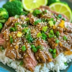 - 1 pound flank steak, thinly sliced against the grain - 1 tablespoon cornstarch - 2 tablespoons sesame oil - 3 cloves garlic, minced - 1 tablespoon ginger, minced - 1/4 cup soy sauce (low sodium) - 1 tablespoon honey - 1 tablespoon rice vinegar - 1/4 teaspoon red pepper flakes (adjust to taste) - 2 tablespoons sesame seeds - 4 green onions, chopped (for garnish) - Cooked jasmine rice, for serving The flank steak gives the dish a nice texture. Slicing against the grain helps keep it tender. Cornstarch makes the beef crispy, which is key for this meal. Sesame oil adds a rich flavor that pairs well with garlic and ginger. The sauce combines soy sauce, honey, and rice vinegar for a sweet and tangy taste. Red pepper flakes bring just the right amount of heat. Garnish with sesame seeds and green onions for color and crunch. - Steamed broccoli - Stir-fried vegetables - Fried rice These sides work well with the main dish. Steamed broccoli is a healthy choice and adds color. Stir-fried vegetables can bring more flavor and nutrition. Fried rice is a classic that can soak up the sauce. - Large skillet or wok - Cutting board - Sharp knife - Mixing bowls - Tongs or spatula Having the right tools makes cooking easier. A skillet or wok is best for searing the beef. A cutting board and knife help you slice the steak. Mixing bowls are perfect for preparing the sauce and coating the beef. Tongs or a spatula will help you flip and serve the beef. Start by taking one pound of flank steak. Slice it thinly against the grain. This helps keep the meat tender. Place the sliced beef in a bowl. Sprinkle one tablespoon of cornstarch over the steak. Toss it well so each piece gets coated. Let it sit for about ten minutes. This makes the beef crispy when you cook it. Grab a large skillet or wok for cooking. Heat one tablespoon of sesame oil over medium-high heat. Once the oil is hot, add the steak in a single layer. If you have a lot of beef, cook it in batches. This keeps the heat high. Cook for about two to three minutes on each side. You want it browned and crispy. When done, remove the beef from the skillet and set it aside. In the same skillet, add the last tablespoon of sesame oil. Next, toss in three cloves of minced garlic and one tablespoon of minced ginger. Sauté these for about thirty seconds. You want them fragrant but not burned. In a small bowl, mix together a quarter cup of low-sodium soy sauce, one tablespoon of honey, one tablespoon of rice vinegar, and a quarter teaspoon of red pepper flakes. Whisk it well. Pour this sauce into the skillet and bring it to a simmer. Let it cook for about two minutes until it thickens a bit. Finally, add the crispy beef back into the skillet. Toss it in the sauce until it’s coated well. Sprinkle two tablespoons of sesame seeds over the top. Cook for one more minute to heat it through. Serve hot over jasmine rice and garnish with chopped green onions. To get that perfect crispy texture, use flank steak. Slice it thinly against the grain. This helps keep the meat tender. Coat the beef with cornstarch. Let it sit for 10 minutes before cooking. This step helps to form a crunchy crust. When cooking, use a hot skillet. Avoid overcrowding the pan; cook in batches if needed. This allows each piece to sear properly. For extra flavor, use fresh garlic and ginger. These add depth and warmth to the dish. Adjust red pepper flakes to your taste. If you like it milder, use less. Honey adds a nice sweetness. You can also try adding a splash of lime juice before serving for freshness. Experiment with sesame oil; it adds a rich, nutty flavor. Make your meal look great with simple touches. Serve the beef over fluffy jasmine rice. Sprinkle extra sesame seeds on top for texture. Add chopped green onions for a fresh look. Place lime slices on the side for color and zest. Use vibrant bowls to make the dish pop. This small detail elevates the whole meal. {{image_2}} You can swap the flank steak for other meats. Try chicken breast for a lighter dish. Thinly sliced pork works well too. For a richer flavor, use beef sirloin. Each option brings its own taste but keeps the dish fun and tasty. For a vegetarian twist, use tofu or tempeh. Press the tofu to remove extra water. Cut it into small cubes and coat them in cornstarch. Pan-fry them until crispy. You can also use seitan as a meat substitute. It absorbs flavors well and adds protein. Mix up the sauce for new flavors. Add orange juice for a citrusy kick. Try adding a spoon of peanut butter for creaminess. You can switch the soy sauce with tamari for a gluten-free option. Experiment with different spices like five-spice powder for a unique taste. You can store leftovers in an airtight container. Let the beef cool down first. Place it in the fridge for up to three days. Keep the rice and beef separate if you can. This helps keep the rice from getting soggy. To reheat, use a skillet over medium heat. Add a splash of water or broth to keep it moist. Stir gently for about five minutes until heated through. You can also use a microwave for quick reheating. Just cover the dish and heat for one to two minutes. If you want to freeze it, let the beef cool completely. Place it in a freezer-safe bag. Remove as much air as possible before sealing. You can freeze it for up to three months. When ready to eat, thaw in the fridge overnight. Reheat as mentioned above for the best results. Yes, you can use other cuts if you want. Sirloin or skirt steak work well. They both cook quickly and have good flavor. Just slice them thinly, like you would flank steak. To lower the heat, cut down on red pepper flakes. You can skip them entirely for no spice. Adding more honey can also help balance the heat. This dish pairs great with jasmine rice. You can also add steamed broccoli for a healthy side. Other veggies, like bell peppers or snap peas, fit nicely too. The recipe is not gluten-free due to soy sauce. However, you can use gluten-free soy sauce. This swap makes the dish safe for those with gluten sensitivities. In this post, we discussed the tasty Crispy Sesame Beef Fakeout. I shared key ingredients, preparation steps, and helpful tips for the best results. You can enjoy variations, like swapping proteins or making it veggie. Remember to store leftovers correctly and follow the reheating tips for freshness. Cooking doesn’t need to be hard. With the right steps and tools, you can impress anyone. Enjoy making this dish and sharing it with loved ones!